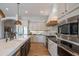 Contemporary kitchen with white cabinets, stainless steel appliances, and a large center island at 1904 N Steele --, Mesa, AZ 85207