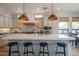 Modern kitchen with large island, stylish backsplash, and stainless steel appliances at 1904 N Steele --, Mesa, AZ 85207