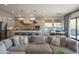 Combined living spaces feature kitchen island, dining table, and sectional sofa at 1904 N Steele --, Mesa, AZ 85207
