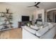 Spacious living room featuring wood floors and modern shelving and decor at 1904 N Steele --, Mesa, AZ 85207