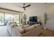 Spacious living room with a large sectional sofa and a sliding glass door at 1904 N Steele --, Mesa, AZ 85207