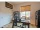 Home office with a dark wood desk, rolling chair, and an area rug at 1904 N Steele --, Mesa, AZ 85207