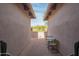 Cozy outdoor patio with brick flooring, a small table and chairs, and serene desert views at 1904 N Steele --, Mesa, AZ 85207