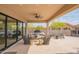 Inviting covered patio with comfortable seating, outdoor grill, and beautiful desert views at 1904 N Steele --, Mesa, AZ 85207