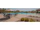 Community pool and recreation area with lounge chairs, ramadas, and mature desert landscaping at 1904 N Steele --, Mesa, AZ 85207