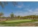Putting green and common green space with native desert landscaping at 1904 N Steele --, Mesa, AZ 85207