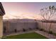 Enclosed backyard features low-maintenance landscaping and views of the surrounding desert mountains; ideal for pets at 19045 W Rose Ln, Waddell, AZ 85355