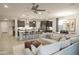 Open-concept design featuring a modern kitchen, cozy living area, and comfortable dining space at 19045 W Rose Ln, Waddell, AZ 85355