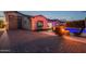 Beautiful backyard showcasing a sparkling pool, fire pit, outdoor seating, and lush greenery at 21617 S 229Th Way, Queen Creek, AZ 85142
