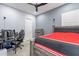 A bedroom featuring an appealing design with stylish furniture and a gaming setup at 21617 S 229Th Way, Queen Creek, AZ 85142