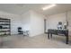 Spacious three car garage with ample room for parking, foosball, storage, and a desk area at 21617 S 229Th Way, Queen Creek, AZ 85142