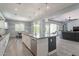 Open kitchen with a large island, stainless steel appliances, and easy access to living areas at 21617 S 229Th Way, Queen Creek, AZ 85142