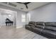 Inviting living room features wood-look tile floors and comfortable seating at 21617 S 229Th Way, Queen Creek, AZ 85142