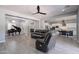 Spacious open-concept living area featuring a grand piano, comfortable seating, and modern decor at 21617 S 229Th Way, Queen Creek, AZ 85142