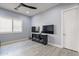Cozy living area with wood-look tile floors and natural light at 21617 S 229Th Way, Queen Creek, AZ 85142