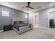 Comfortable main bedroom features soft carpet and ensuite bathroom at 21617 S 229Th Way, Queen Creek, AZ 85142