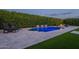 Backyard pool with water features, lounge chairs, turf and a privacy hedge at 21617 S 229Th Way, Queen Creek, AZ 85142