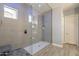 Modern walk-in shower with glass enclosure and stylish tile at 21617 S 229Th Way, Queen Creek, AZ 85142