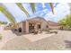 Relaxing backyard with patio seating, desert landscaping, and serene environment at 22300 N Kingston Dr, Maricopa, AZ 85138