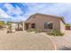 Beautiful backyard with a covered patio, low-maintenance landscaping, and a peaceful ambiance at 22300 N Kingston Dr, Maricopa, AZ 85138