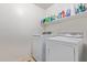 Functional laundry room featuring a washer and dryer for convenient chores at 22300 N Kingston Dr, Maricopa, AZ 85138