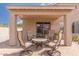 Covered patio with an outdoor seating area, perfect for relaxation at 22300 N Kingston Dr, Maricopa, AZ 85138