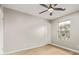 Neutral bedroom with a ceiling fan, and bright natural light at 2331 W Hartford Ave, Phoenix, AZ 85023