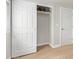 Bright bedroom featuring neutral walls, light floors, and an open closet with tools at 2331 W Hartford Ave, Phoenix, AZ 85023