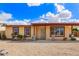 Charming single-story home with desert landscaping and a covered front porch at 2331 W Hartford Ave, Phoenix, AZ 85023