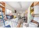 Cluttered garage with storage solutions and various tools and equipment at 2331 W Hartford Ave, Phoenix, AZ 85023