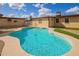 Backyard pool with artificial turf and stone at 2331 W Hartford Ave, Phoenix, AZ 85023