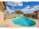Backyard pool and low-maintenance artificial turf area at 2331 W Hartford Ave, Phoenix, AZ 85023