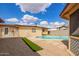 View of the backyard of the property with the pool at 2331 W Hartford Ave, Phoenix, AZ 85023
