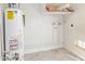 Utility room featuring tile flooring, water heater, plumbing, and shelving at 2331 W Hartford Ave, Phoenix, AZ 85023