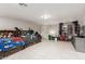 Spacious spare bedroom with two beds, white tile flooring and a neutral color palette at 23405 N 84Th St, Scottsdale, AZ 85255