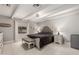 Comfortable main bedroom with a beamed ceiling, tile flooring, and neutral tones at 23405 N 84Th St, Scottsdale, AZ 85255