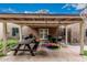 Entertainer's patio with a covered area, picnic table, outdoor kitchen, and play equipment at 23405 N 84Th St, Scottsdale, AZ 85255