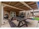 Rear yard with patio and kitchen featuring a picnic table and a built-in barbecue setup at 23405 N 84Th St, Scottsdale, AZ 85255