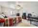 Bright bedroom with a desk, chair and windows providing natural light at 2400 E Baseline Ave # 94, Apache Junction, AZ 85119