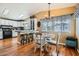 Open-concept dining area with access to the kitchen and bright windows at 2400 E Baseline Ave # 94, Apache Junction, AZ 85119