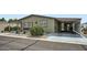 A charming single-story home showing the carport and desert-style landscaping at 2400 E Baseline Ave # 94, Apache Junction, AZ 85119