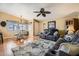 Open living room with hardwood floors, comfortable seating, and dining area at 2400 E Baseline Ave # 94, Apache Junction, AZ 85119