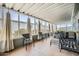 Relaxing enclosed patio with neutral-toned curtains, tile flooring, and comfortable seating at 2400 E Baseline Ave # 94, Apache Junction, AZ 85119