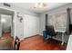Well-lit bedroom with hardwood floors and large closet, offering comfortable and versatile living space at 2434 W Eugie Ave, Phoenix, AZ 85029