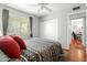 Comfortable bedroom with natural light, hardwood floors, and closet providing a practical and inviting space at 2434 W Eugie Ave, Phoenix, AZ 85029