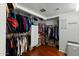 Spacious walk-in closet with custom shelving and hanging rods for optimal organization at 2434 W Eugie Ave, Phoenix, AZ 85029