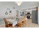 Dining area opens to kitchen, complete with table setting and decorative wall art at 2434 W Eugie Ave, Phoenix, AZ 85029