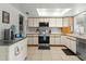 Modern kitchen with stainless steel appliances, ample counter space, and a skylight at 2434 W Eugie Ave, Phoenix, AZ 85029