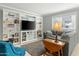 Bright living room featuring a built-in entertainment center and natural light at 2434 W Eugie Ave, Phoenix, AZ 85029