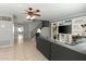 Open-concept living room with tile flooring and stairs leading to the second floor at 2434 W Eugie Ave, Phoenix, AZ 85029